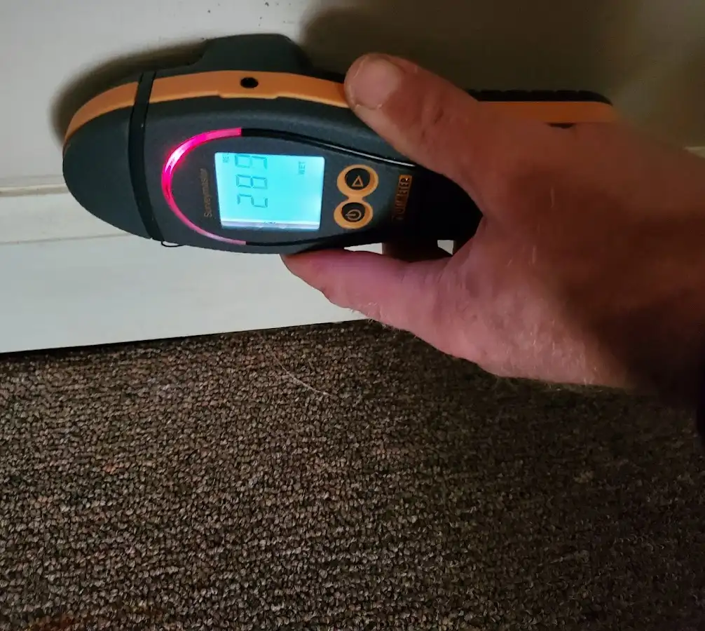 Moisture detection at baseboard during Storm Damage Restoration in Medina